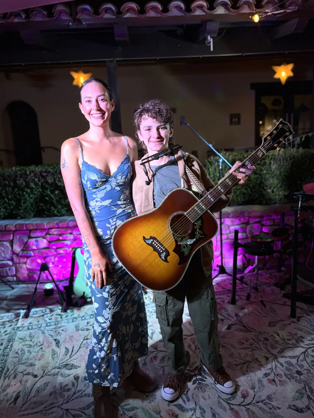 Bella Popa with a young guitarist after his set at her Miramonte Winery open mic