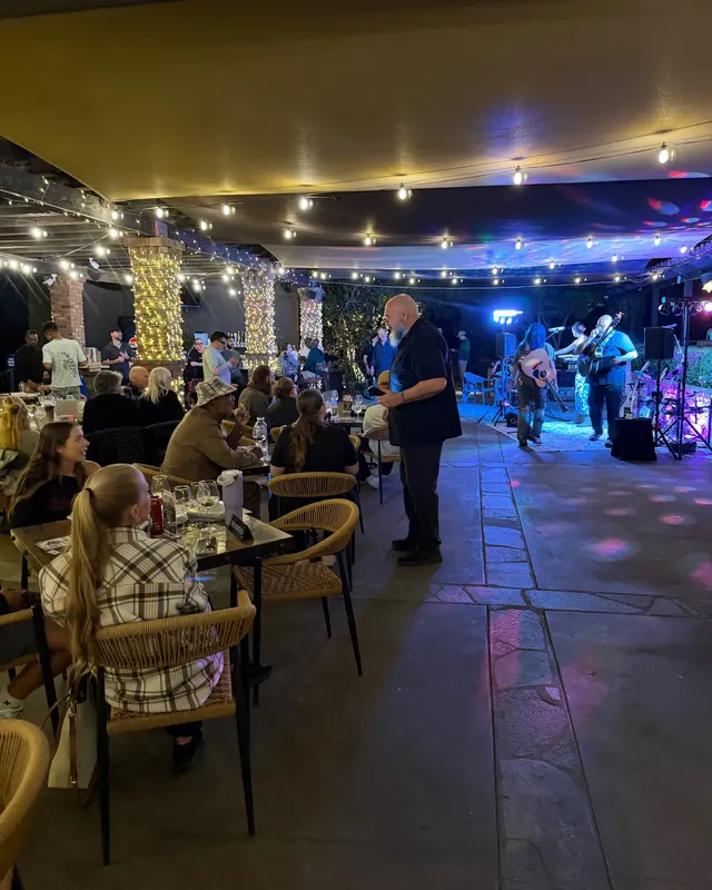A full patio of guests enjoying the open mic at Miramonte Winery